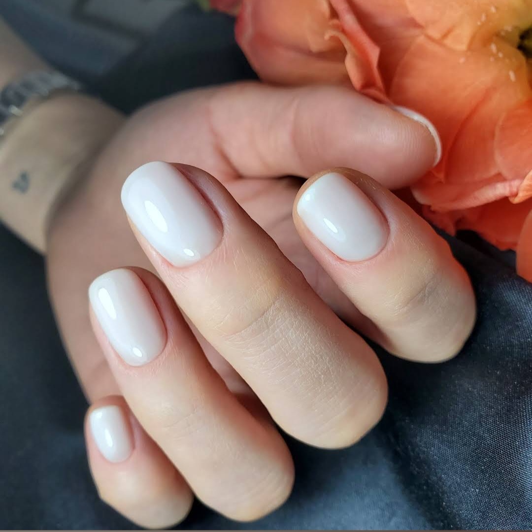 Milky white short Russian manicure with peach rose